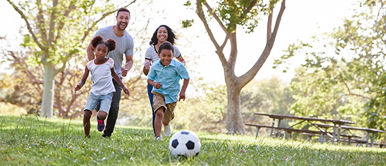Family playing in a park