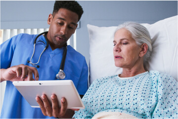 Male nurse talking to patient