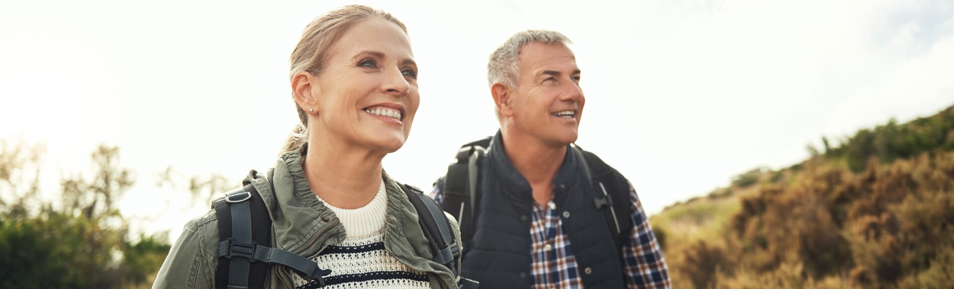 Couple on a hike smiling